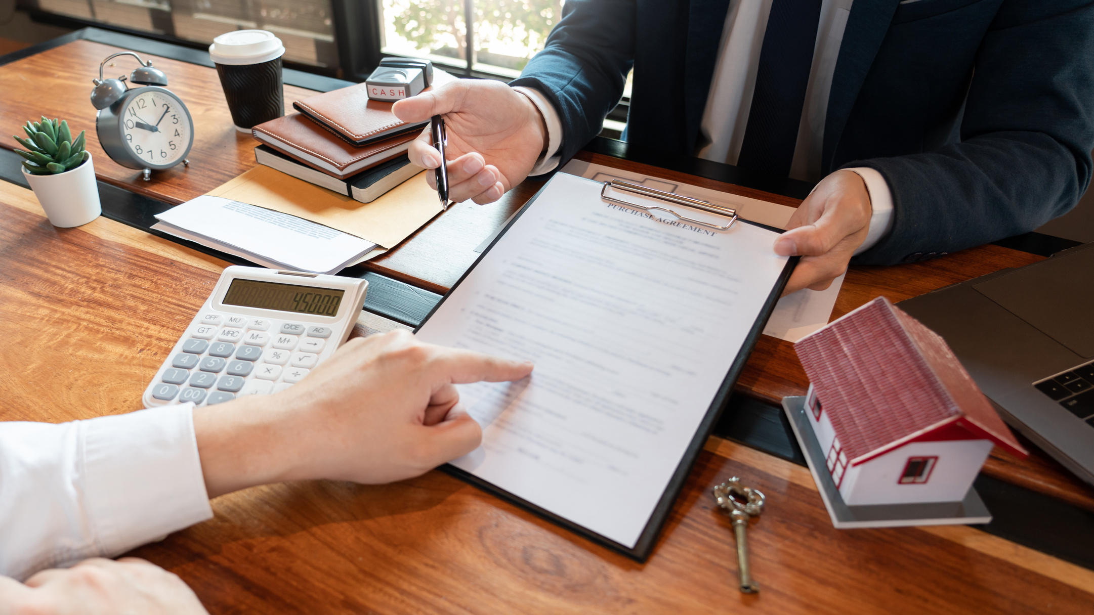 Real Estate Agent Discussing Contract with Investor